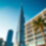 The striking facade of Burj Daman Office Tower against a clear blue sky.
